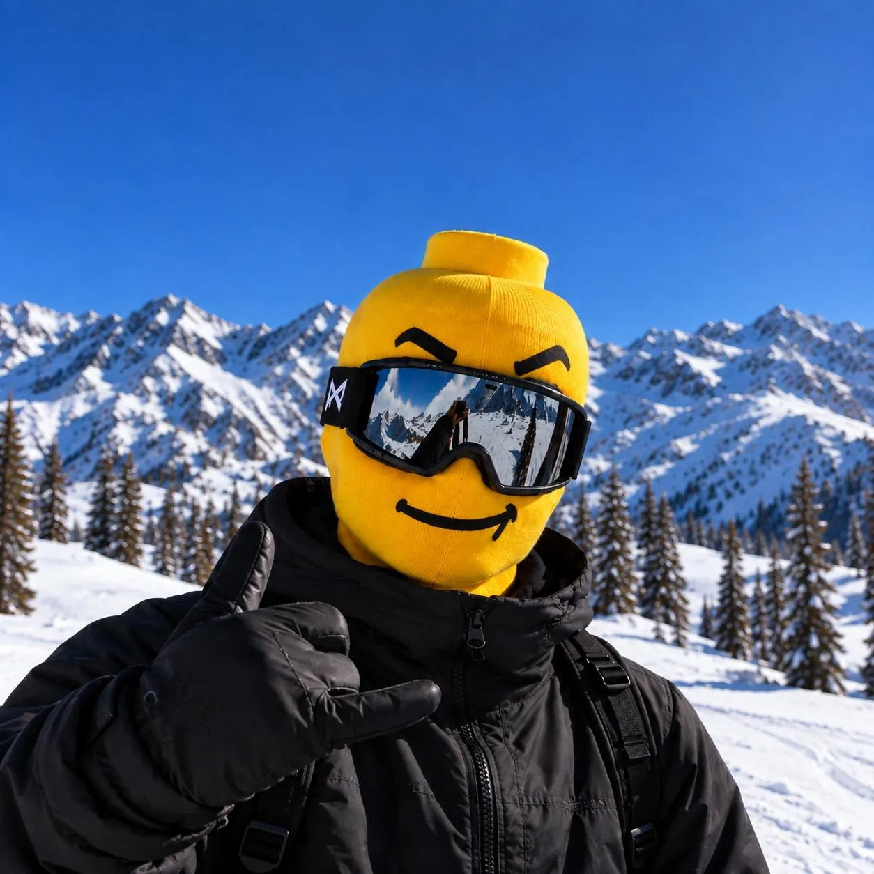 Yellow knit ski mask with a smile, worn on a sunny day on the slopes